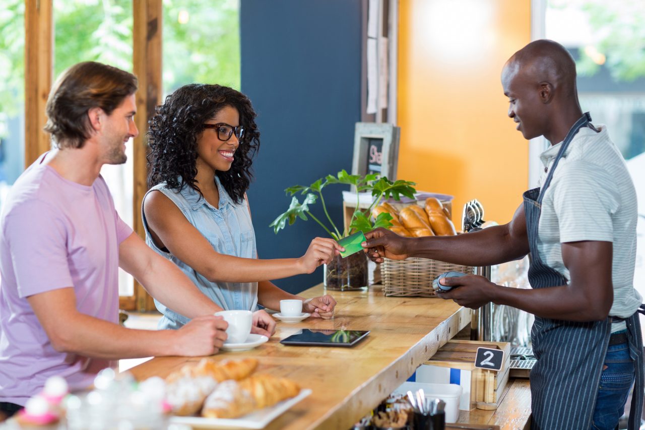 Woman paying with credit card