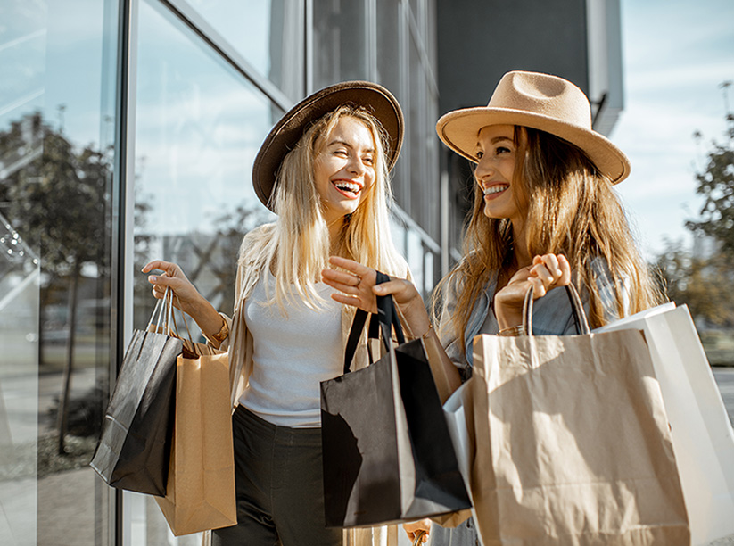 two women with shopping bags