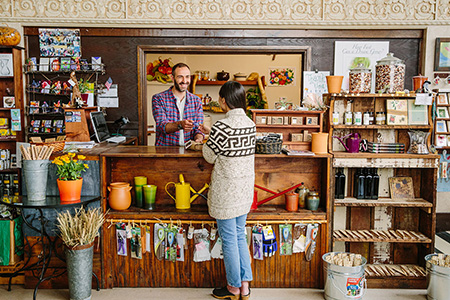 Woman paying for purchase in retail store