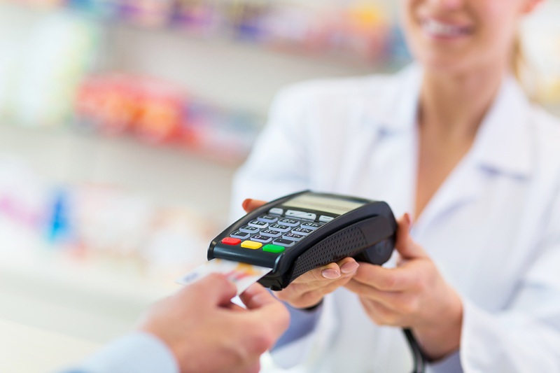 healthcare payment terminal held by woman